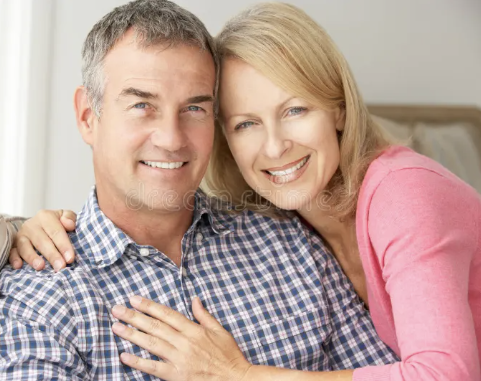 The Johnson Family smiling together at home