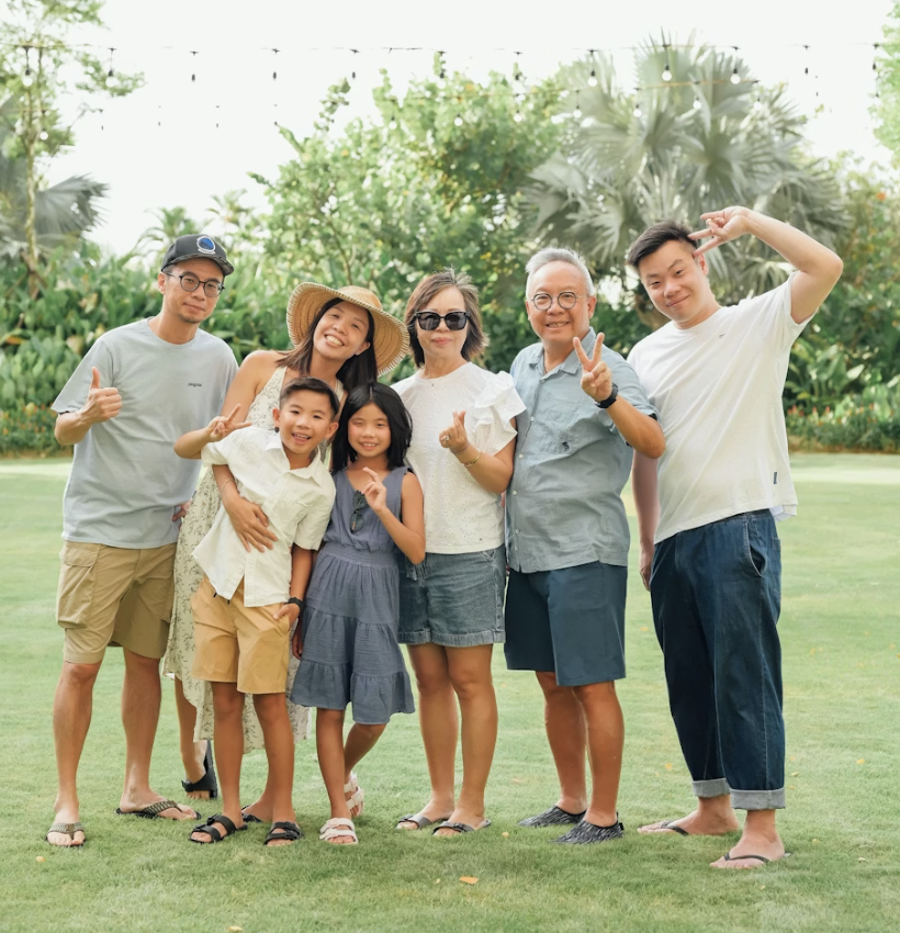 Multi-generational Asian family portrait outdoors